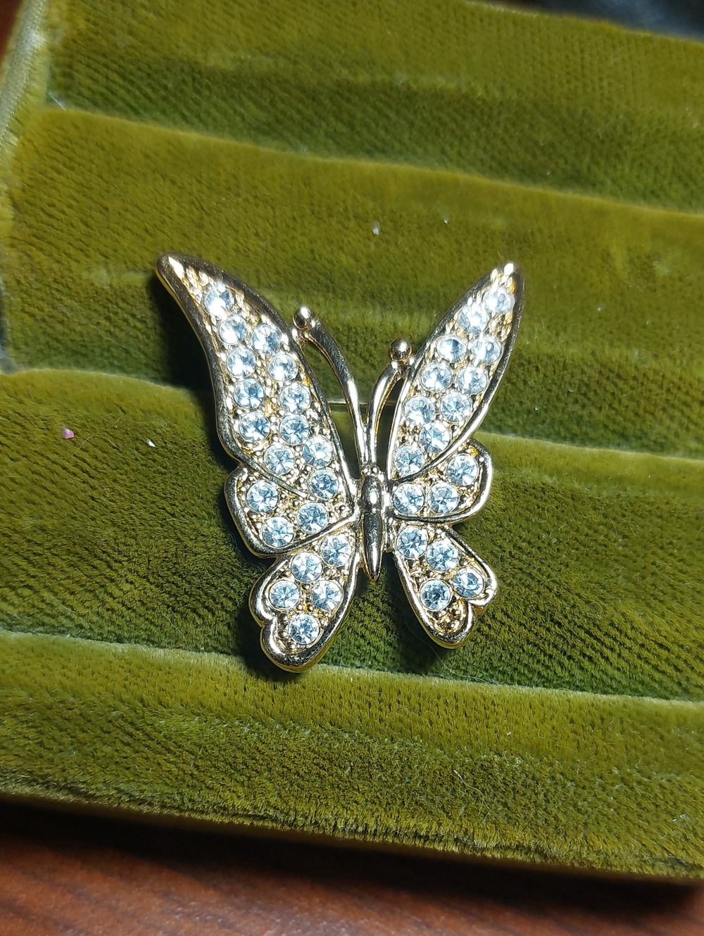 Vintage open-wing pavé rhinestone butterfly brooch.